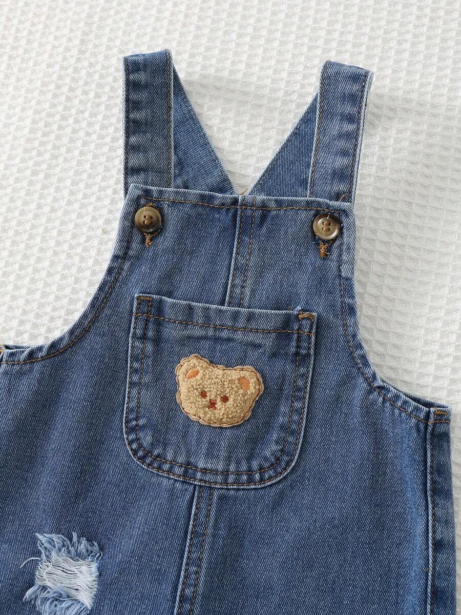 Jardineira Jeans Ursinho para Bebê · Jeans escuro com rasgos 