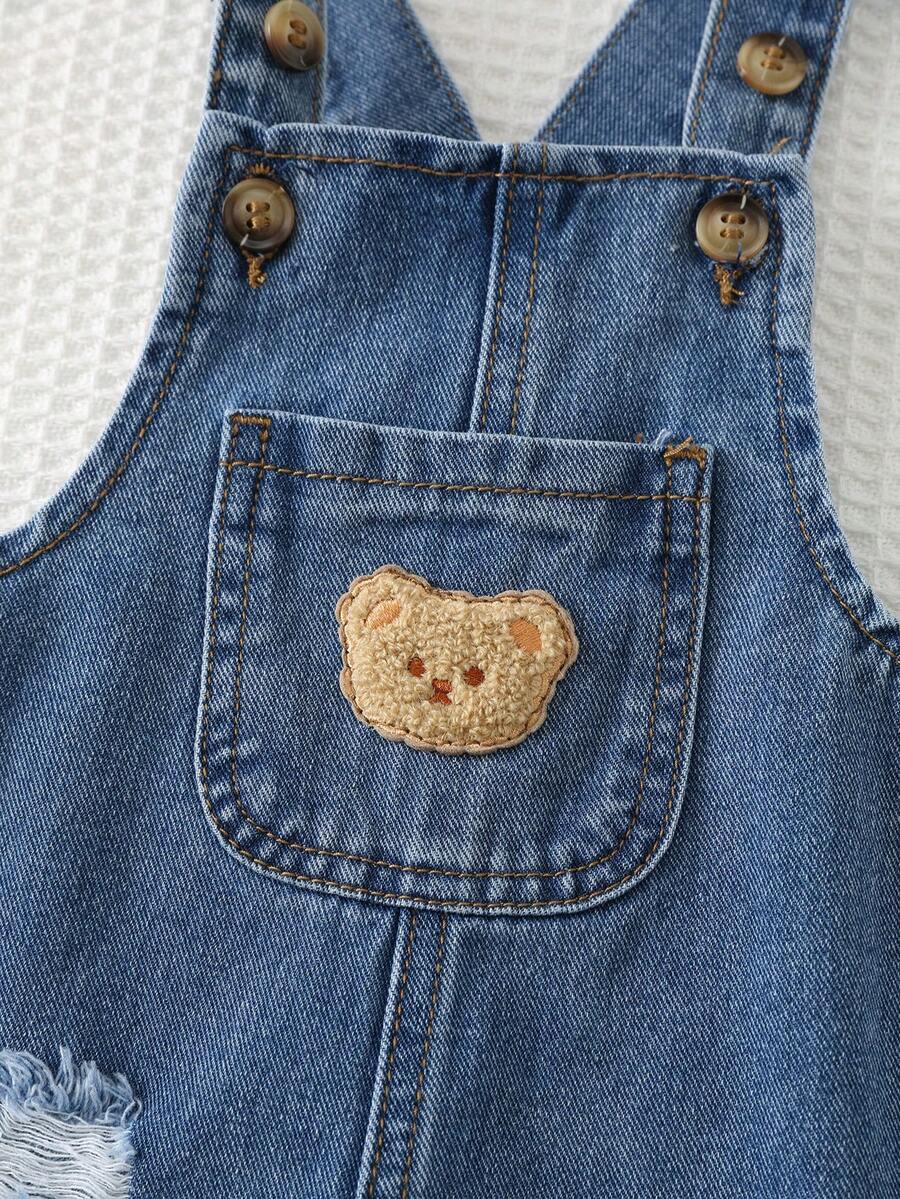 Jardineira Jeans Ursinho para Bebê · Jeans escuro com rasgos 