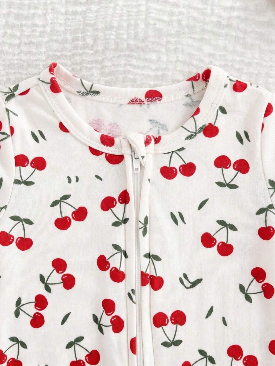 Macacão com pezinhos e zíper para bebê · Cerejas branco 