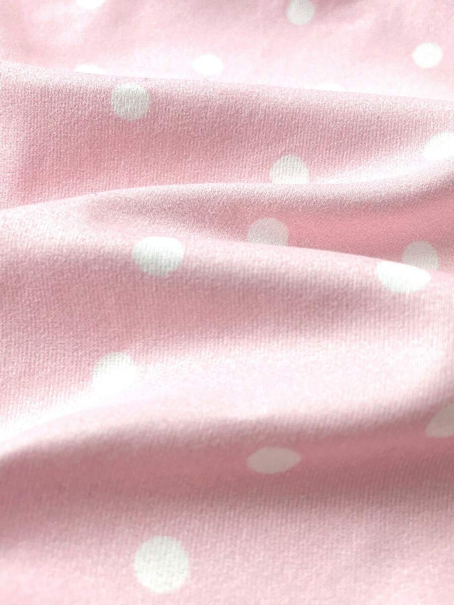 Macacão com pezinhos e zíper para bebê · Poá rosa 