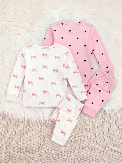 Kit com 2 pijamas estampados para bebê · Laços e corações 