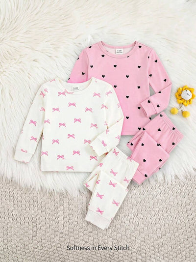 Kit com 2 pijamas estampados para bebê · Laços e corações 