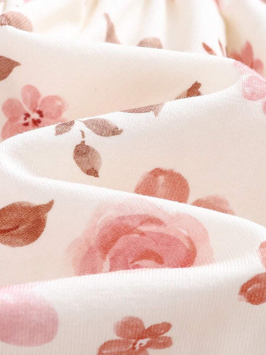 Conjunto vestido estampado e casaquinho · Floral rosa 