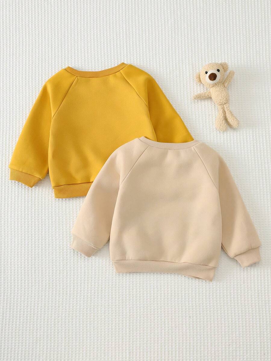 Kit com 2 Moletons para Bebê Bichinhos · Leão amarelo e urso bege 