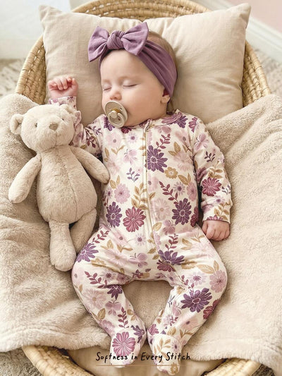 Macacão com pezinhos e zíper para bebê · Floral lilás 