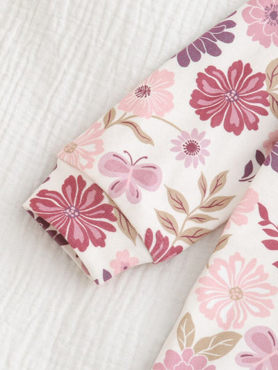 Macacão com pezinhos e zíper para bebê · Floral lilás 